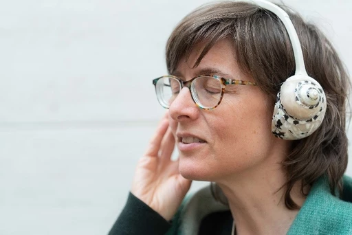 Sharon Stewart, listening through Bert Theis’ F.M.1, F.M.2, F.M.3, F.M.4, F.M.5 (1999) installation at MUDAM Luxembourg. Photo: David Berg